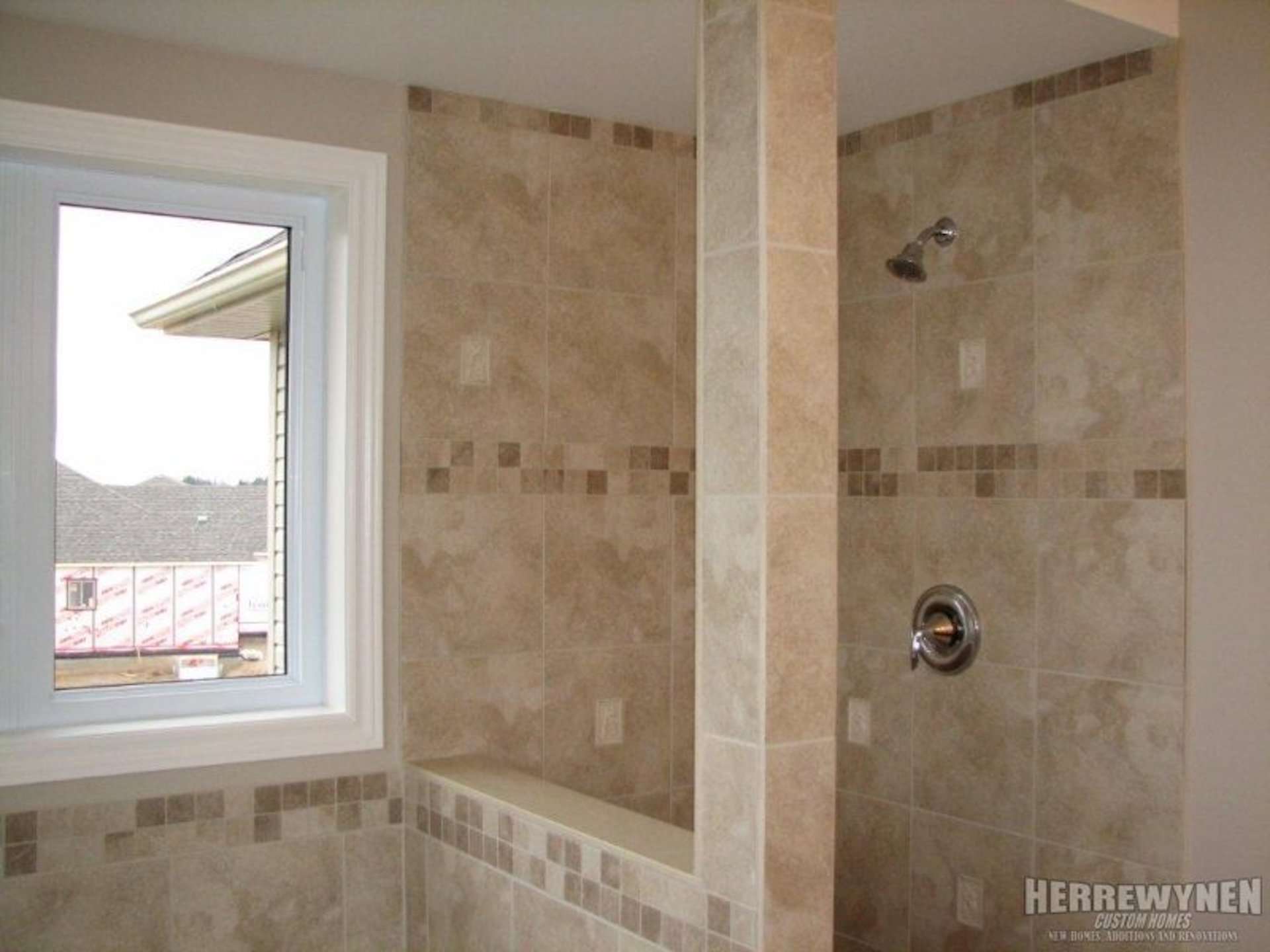 Stand up shower with light tiles and window